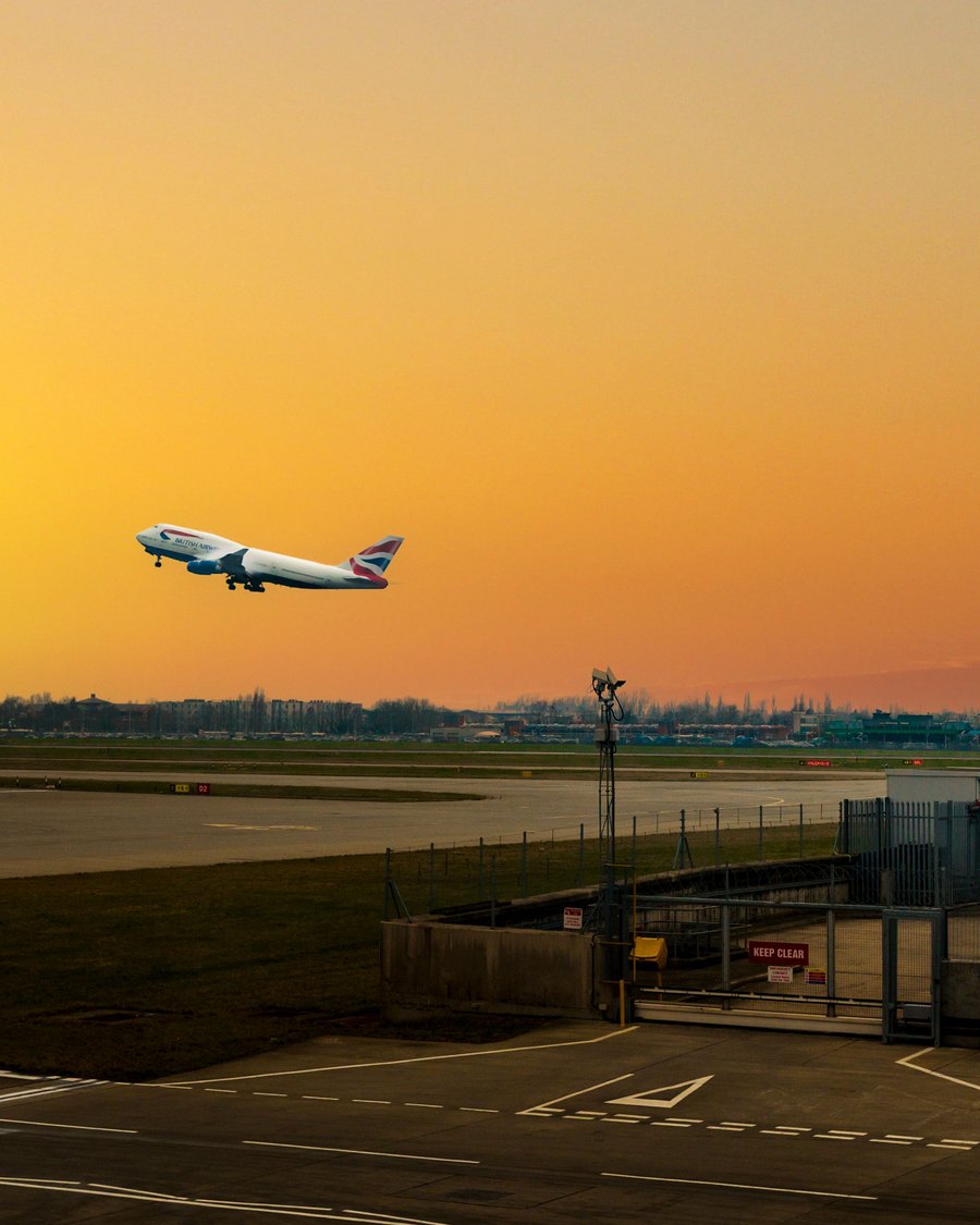 Aircraft departing at sunset